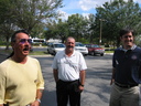 Paul, Doug, and Geoff hang around the parking lot.