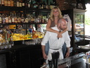 Not to be distracted, Scott went about his business with Liana on his back behind the bar at Harry's Country Club.